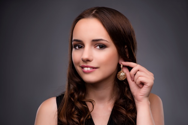 Young woman showing her new earrings