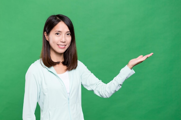 Young woman showing open palm