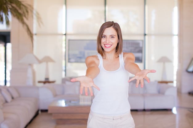 young woman showing sign in a resort