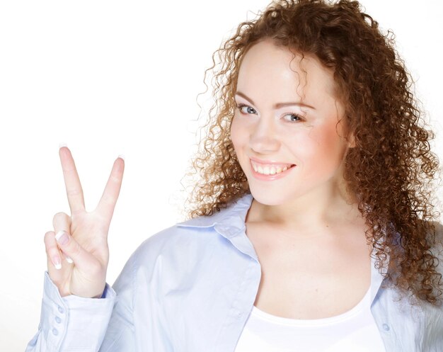 Young woman showing the sign of victory