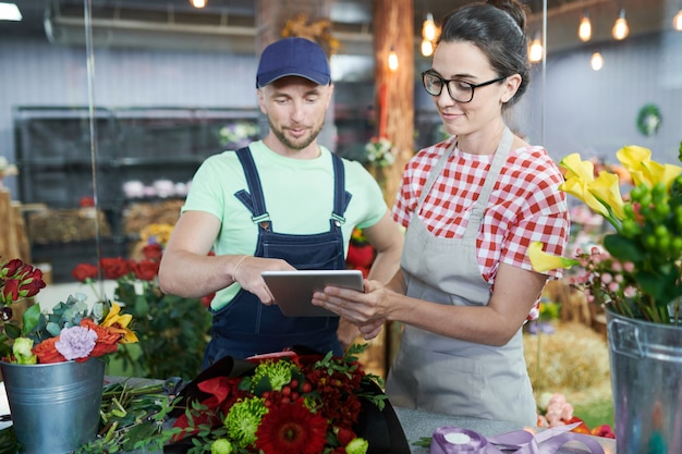 Young Woman Signing Delivery Order