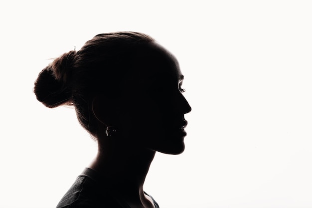 Young woman silhouette profile portrait isolated