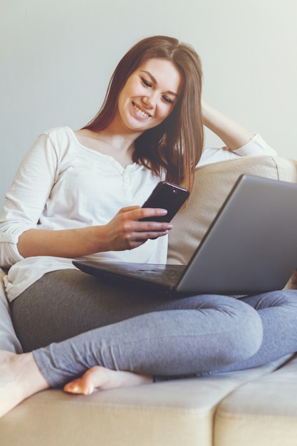 Young woman sitting on the couch