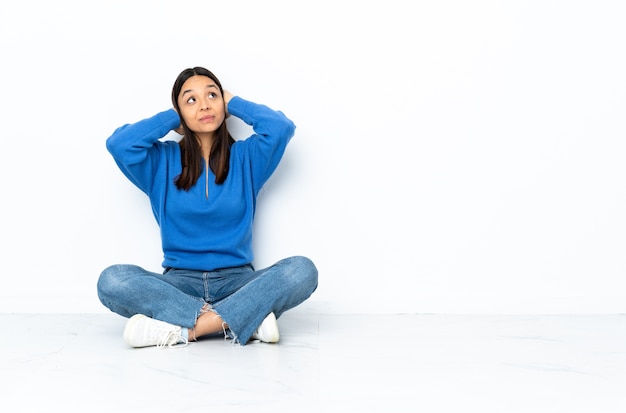 Young woman sitting on the floor