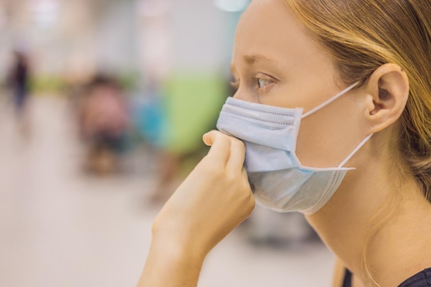 Young woman sitting in hospital waiting for a doctor's appointment Patients In Doctors Waiting Room