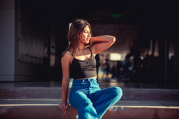 Young woman sitting on a staircase