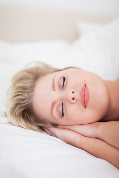 Young woman sleeping with make up on her face