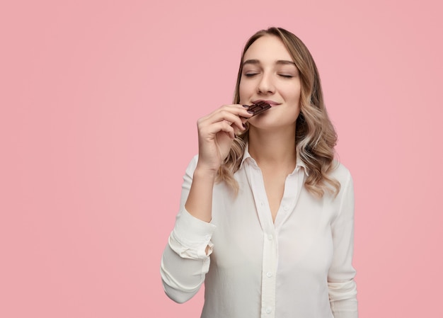 Young woman smelling chocolate