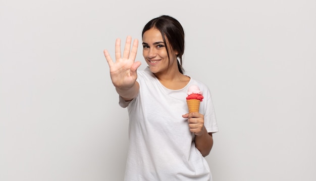 Young woman smiling and looking friendly