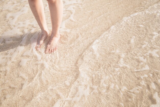 Young woman standing on the beach