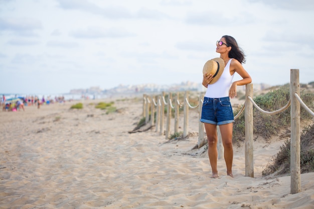 Young woman standing on the beach