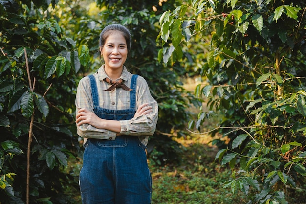 Young woman standing with smiling at coffee farm