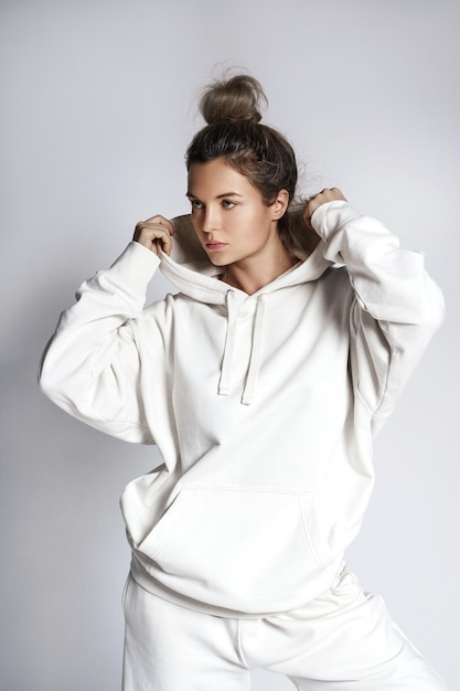 Young woman stylish woman wearing white hoodie