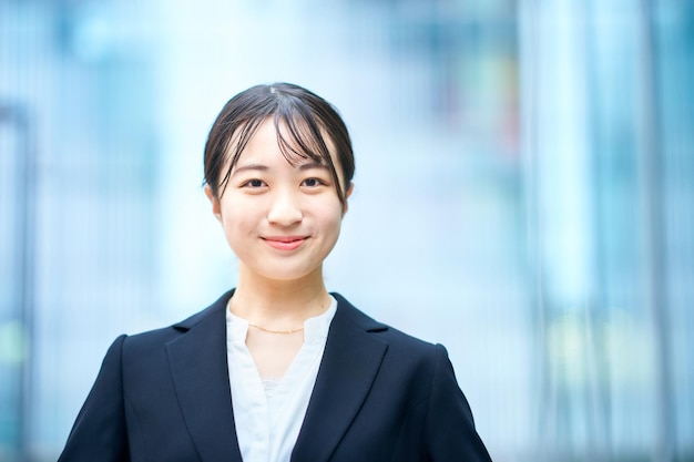 Young woman in suit outdoors