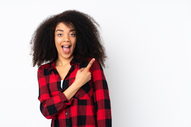 Young woman over surprised and pointing side