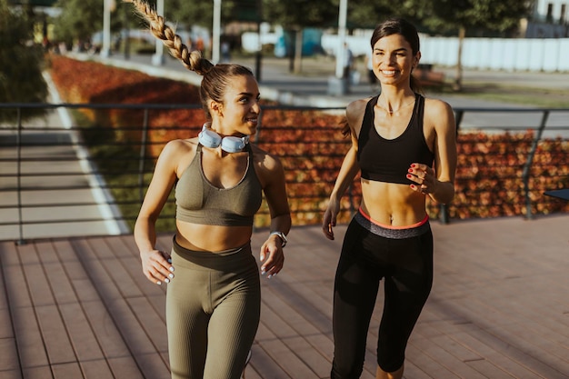 Young woman taking running exercise by the river promenade