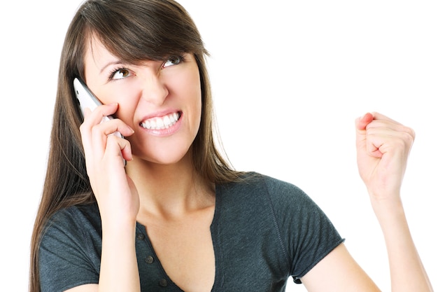 a young woman talking on the phone over white background