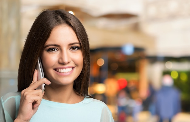 Young woman talking on the phone