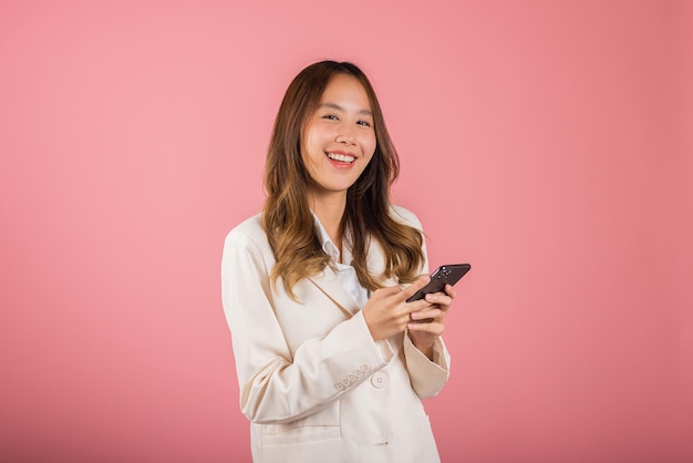 Young woman teen smiling excited hold smart mobile phone