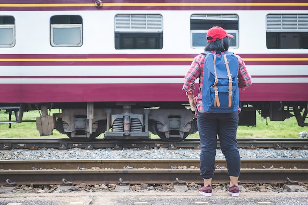 young woman tourism standing on train station platform 