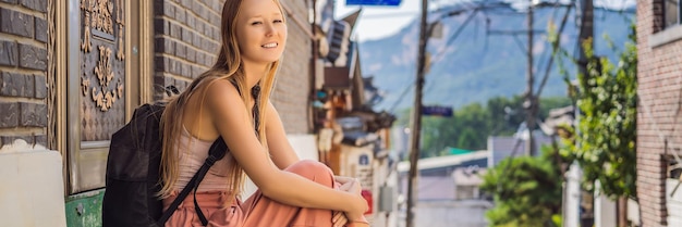 Young woman tourist in bukchon hanok village is one of the famous place for korean traditional