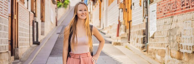 Young woman tourist in bukchon hanok village is one of the famous place for korean traditional