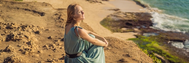 Young woman tourist on pantai tegal wangi beach bali island indonesia bali travel concept banner