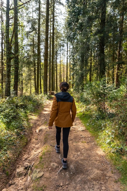 A young woman on the trail up Mount Andatza in the town of Usurbil Gipuzkoa Basque Country