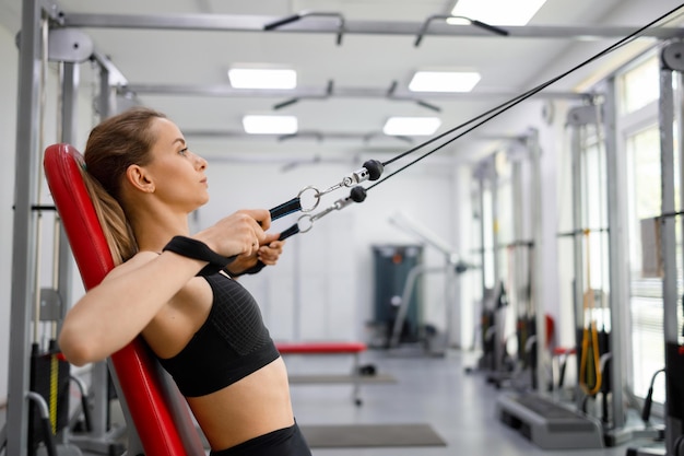 Young woman training in gym rehabilitation center