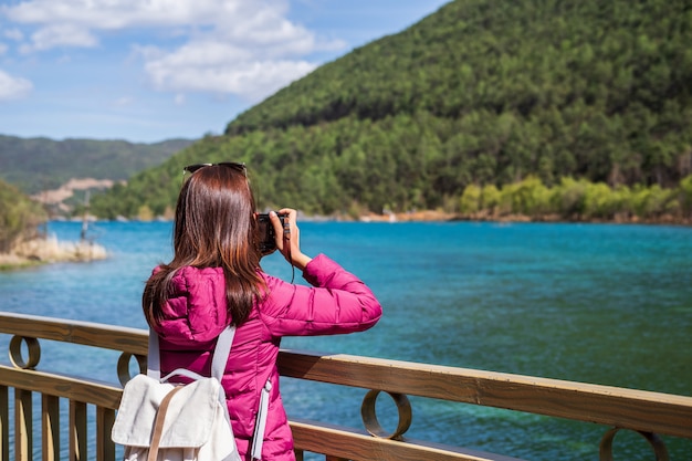 Young woman traveler looking beautiful nature at blue moon valley in China, Travel lifestyle 