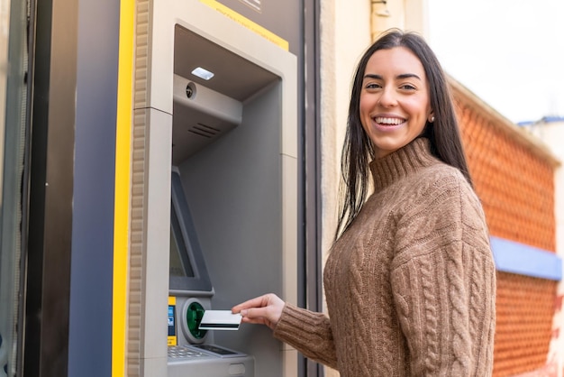 Young woman using an ATM