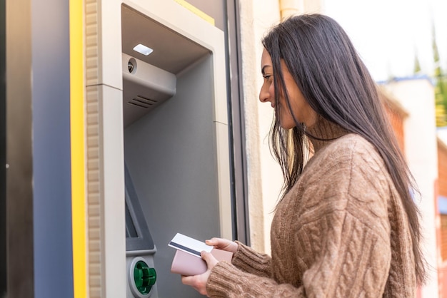 Young woman using an ATM