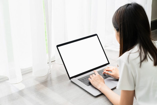 Young woman using a laptop at home