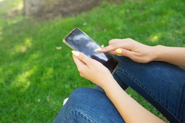 Young woman using mobile phone in outdoors