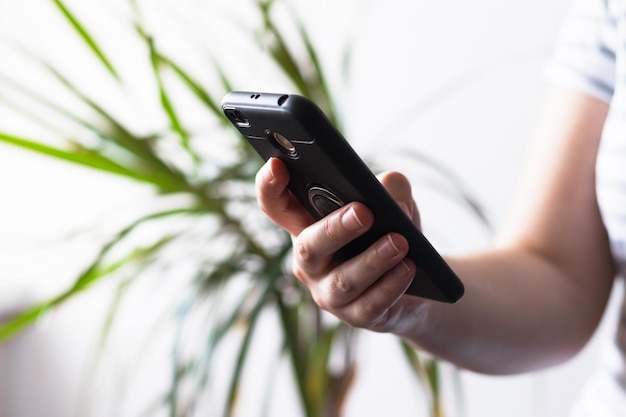 Young woman using phone Female holding smartphone