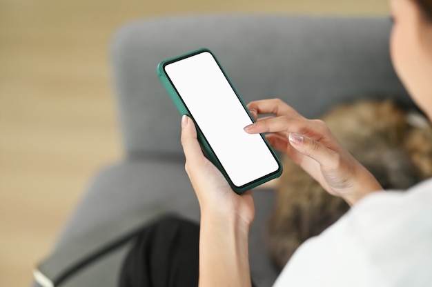 Young woman using a smartphone at home