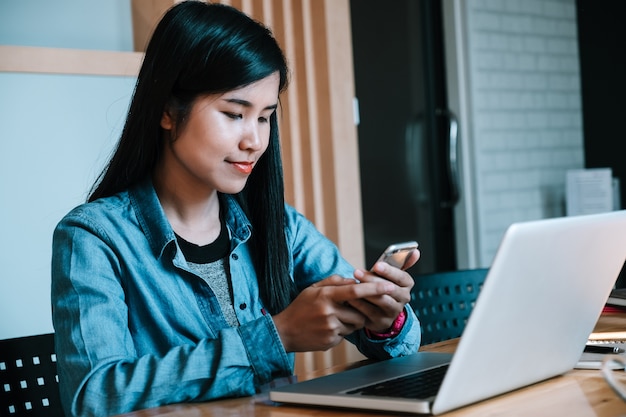 Young woman using smartphone