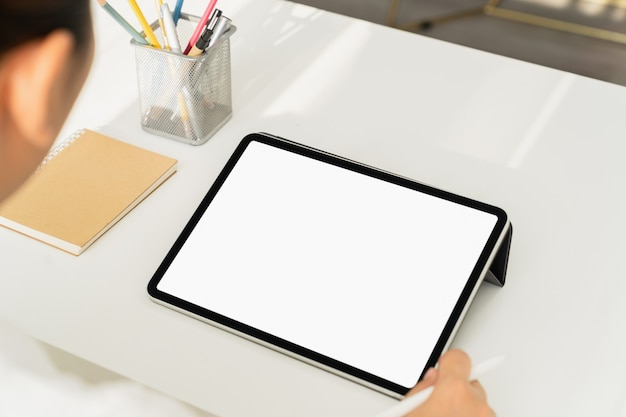 Young woman using a tablet at home