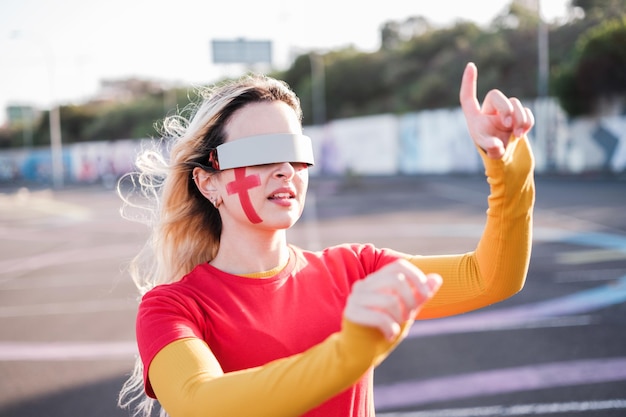 Young woman using virtual reality glasses to follow her team and cheer with new technologies Concept fans virtual reality glasses technology