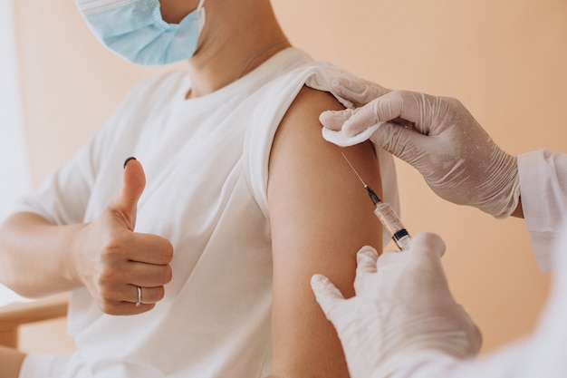 Young woman vaccinating at hospital