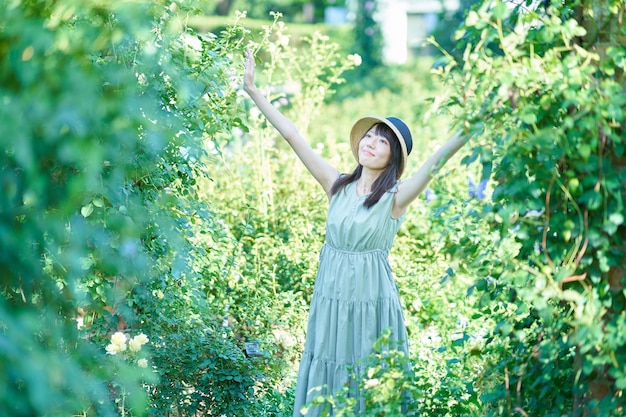 Young woman walking in green