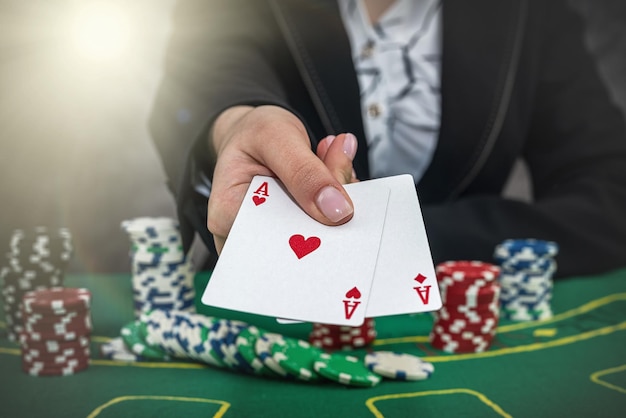 Young woman wear black suit playing poker in casino winner