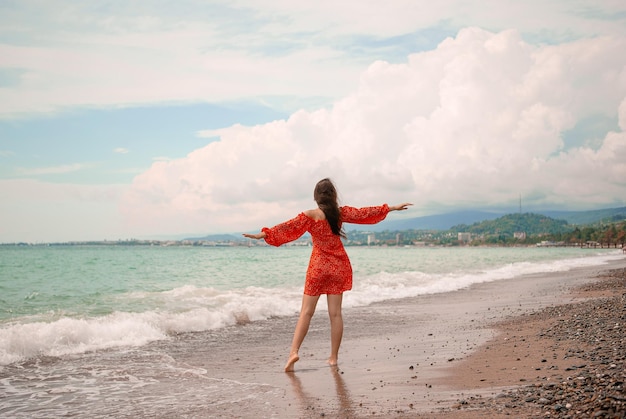 Young woman in white on the beach