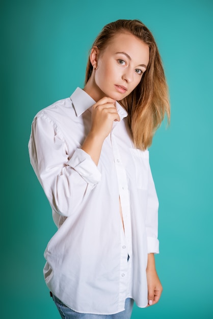 Young woman in white shirt posing