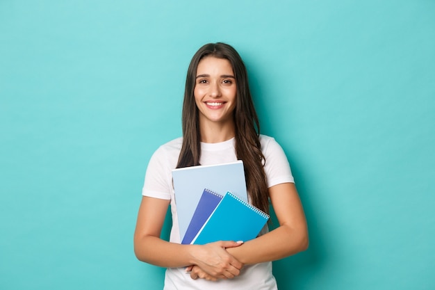 Young woman in white T-shirt posing