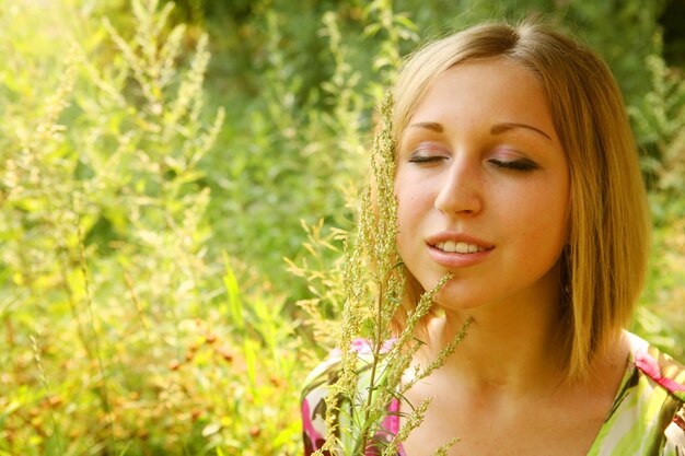 Young woman and wild flowers