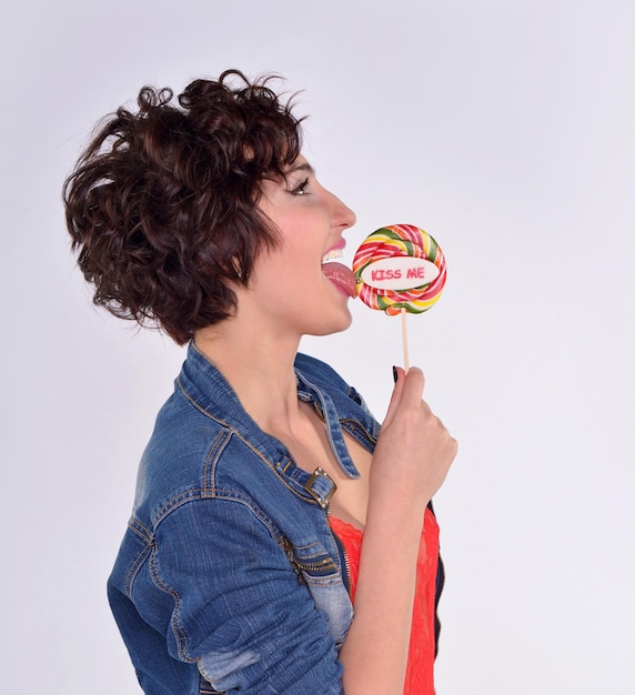 Young woman with big lollipop