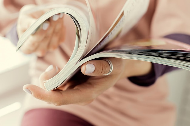 Young woman with a booklet with blank pages