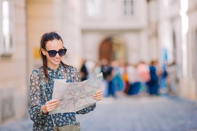 Young woman with a city map