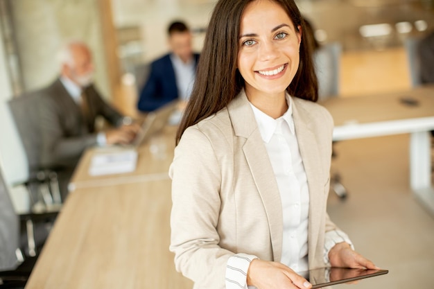 Young woman with digital tablet in the office